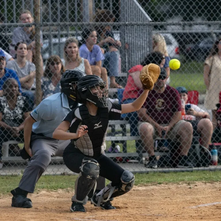 Catcher catching a softball.