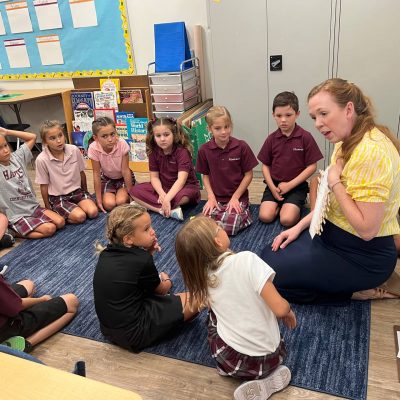 Teacher with 3rd grade students.